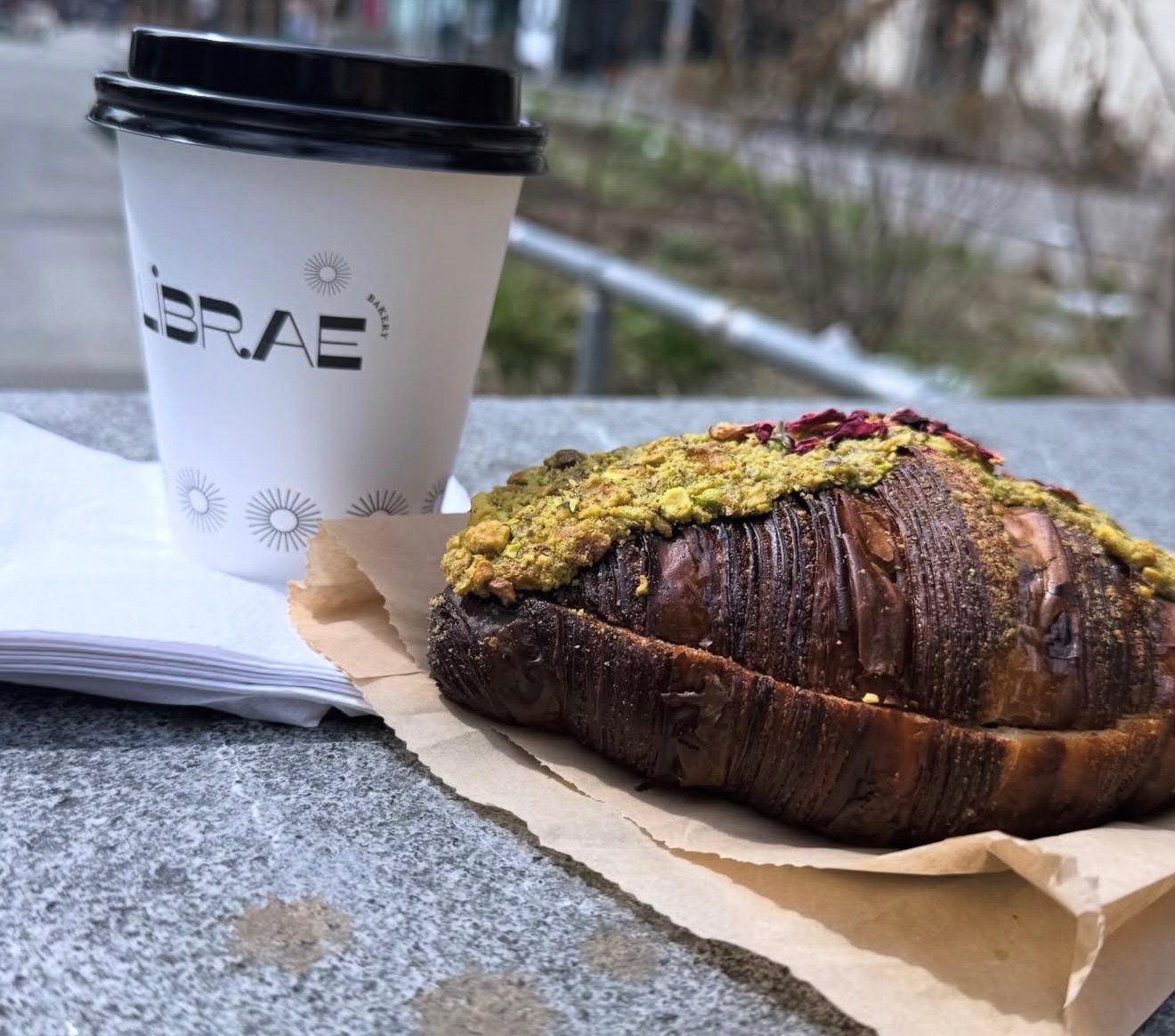 Librae Bakery pistachio croissant and coffee
